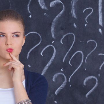 toco warranty extended car warranty woman thinking blackboard with question marks on it